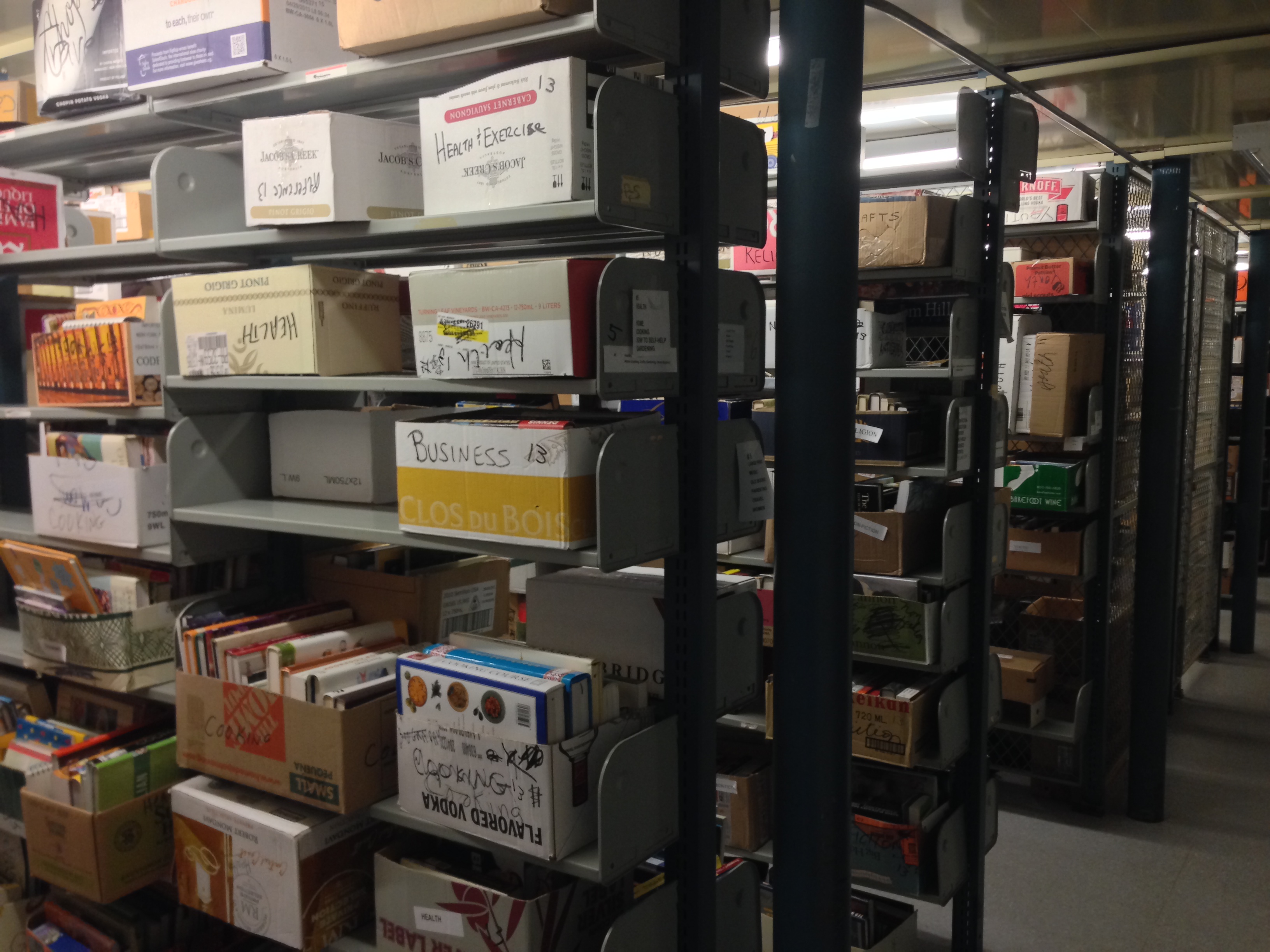 shelves storing boxes of books